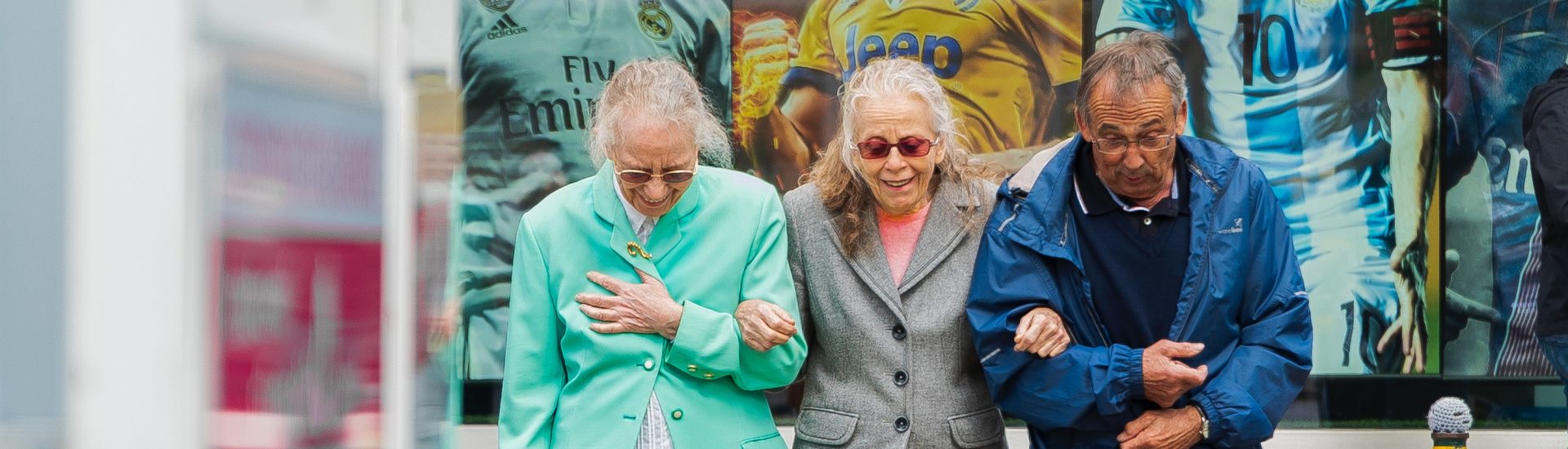 elderly group helping eachother